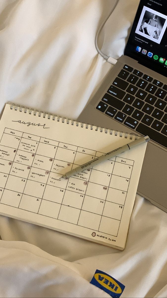 A planner and laptop laid out for mapping application deadlines