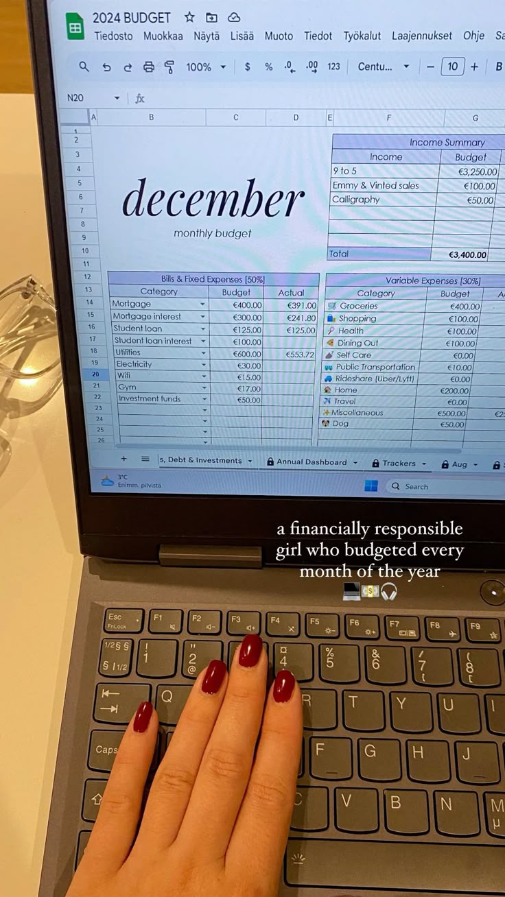 A hand using a phone calculator over a stack of documents