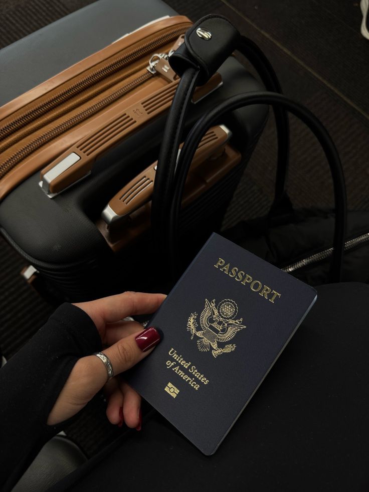 A travel map, notebook, and backpack arranged for a move abroad