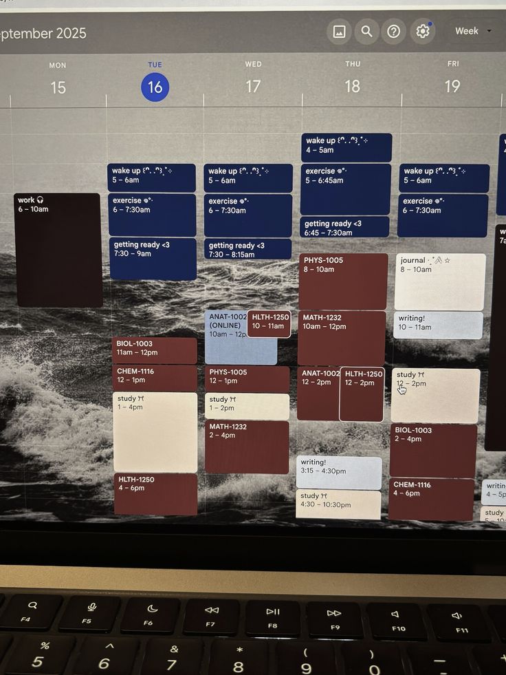 A planner, calendar, and laptop laid out for mapping application deadlines