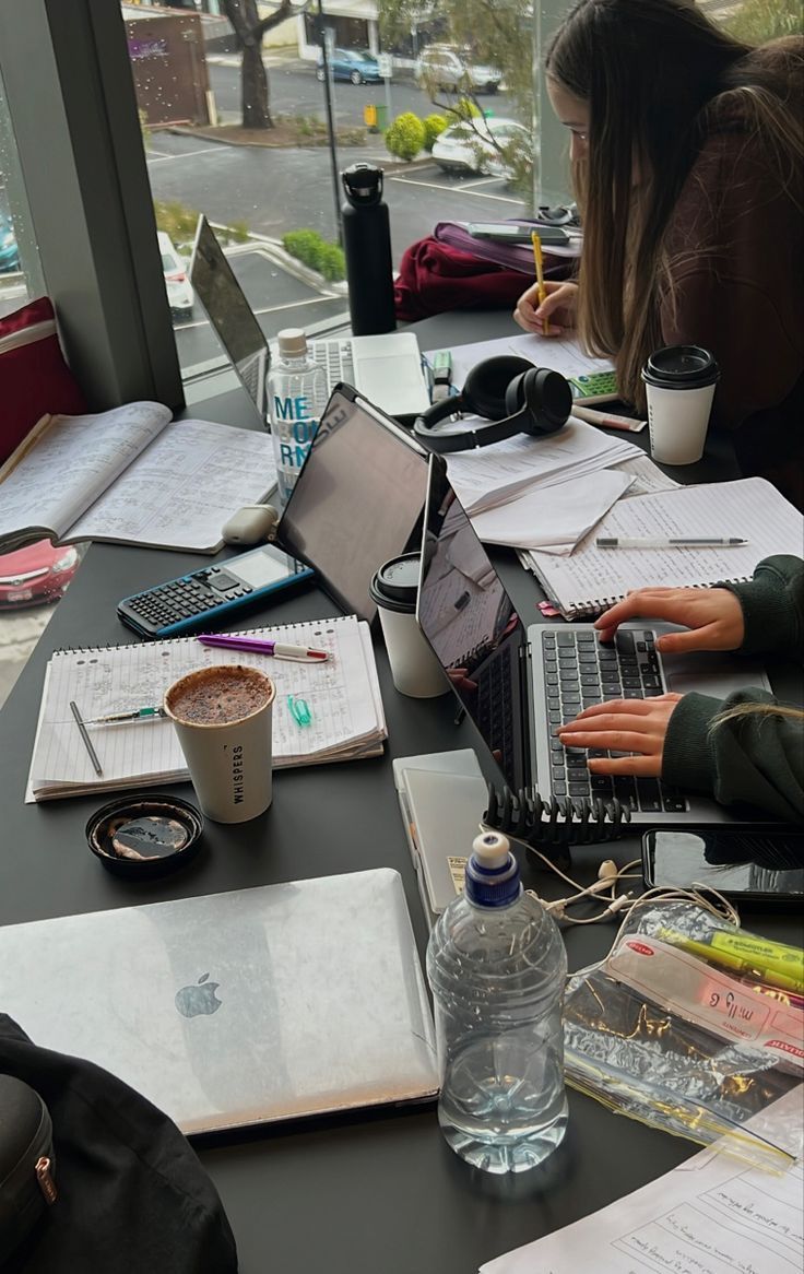 International students studying together at a table in a university library
