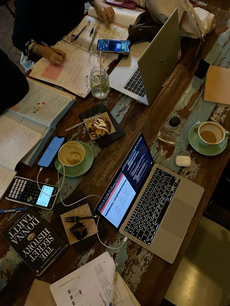 International students studying together at a table in a university library